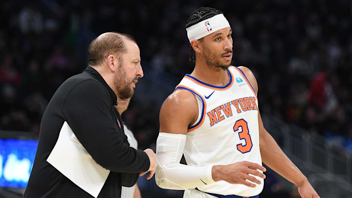 New York Knicks coach Tom Thibodeau talks with New York Knicks guard Josh Hart (3) on the sideline against the Milwaukee Bucks in the first half at Fiserv Forum.