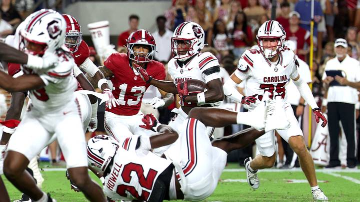 Sep 26, 2026; Tuscaloosa, Alabama, USA;  South Carolina Gamecocks wide receiver Stone Furrey (18) tries to avoid teammate running back Jawarn Howell (22) during the second quarter against the Alabama Crimson Tide at Saban Field at Bryant-Denny Stadium.  Mandatory Credit: David Leong-Imagn Images