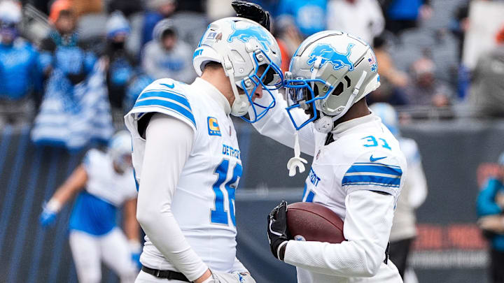 Detroit Lions quarterback Jared Goff embraces safety Kerby Joseph before a game against Chicago Bears.