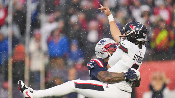 Jan 18, 2026; Foxborough, MA, USA; New England Patriots linebacker K'Lavon Chaisson (44) tackles Houston Texans quarterback C.J. Stroud (7) in the second quarter in an AFC Divisional Round game at Gillette Stadium. Mandatory Credit: David Butler II-Imagn Images