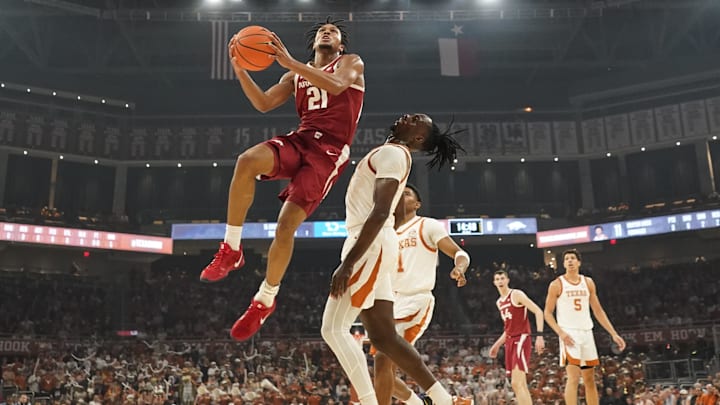 Arkansas Razorbacks guard D.J. Wagner (21) drives to the basket while defended by Texas Longhorns forward Arthur Kaluma (6) during the first half at Moody Center. 