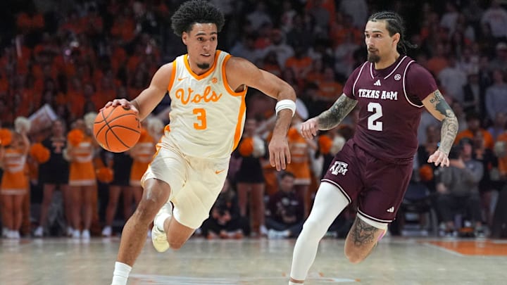 Tennessee guard Bishop Boswell (3) dribbles the ball past Texas A&M guard Pop Isaacs (2) during a NCAA basketball game between Tennessee and Texas A&M at Thompson-Boling Arena at Food City Center in Knoxville, Tenn., on Jan. 13, 2026.