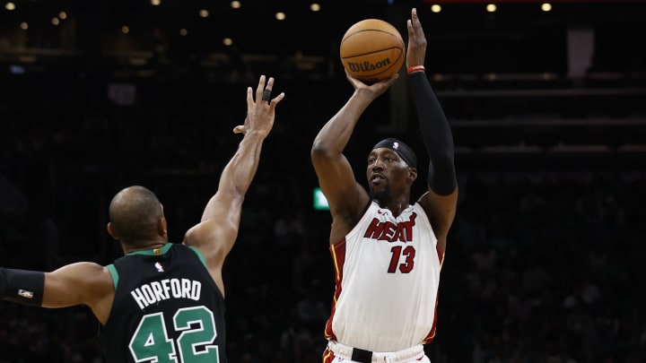 May 1, 2024; Boston, Massachusetts, USA; Miami Heat center Bam Adebayo (13) shoots against Boston Celtics center Al Horford (42) during the first quarter of game five of the first round of the 2024 NBA playoffs at TD Garden. Mandatory Credit: Winslow Townson-USA TODAY Sports