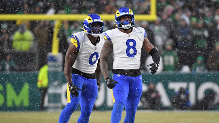 Jan 19, 2025; Philadelphia, Pennsylvania, USA; Los Angeles Rams linebacker Byron Young (0) and linebacker Jared Verse (8) celebrate a sack against the Philadelphia Eagles in a 2025 NFC divisional round game at Lincoln Financial Field. Mandatory Credit: Eric Hartline-Imagn Images Jan 19, 2025; Philadelphia, Pennsylvania, USA; Los Angeles Rams linebacker Byron Young (0) and linebacker Jared Verse (8) celebrate a sack against the Philadelphia Eagles in a 2025 NFC divisional round game at Lincoln Financial Field. Mandatory Credit: Eric Hartline-Imagn Images