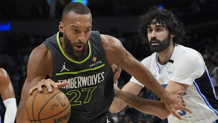 Minnesota Timberwolves center Rudy Gobert works past Orlando Magic center Goga Bitadze at Target Center in Minneapolis on March 14, 2025.