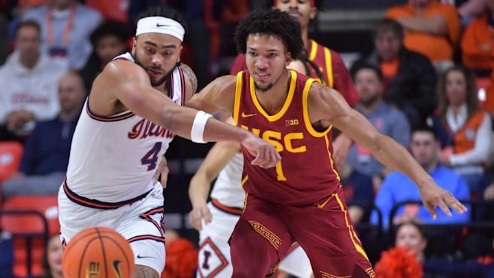 Jan 11, 2025; Champaign, Illinois, USA; Illinois Fighting Illini guard Kylan Boswell (4) and USC Trojans guard Desmond Claude (1) vie for a loose ball during the first half at State Farm Center. Mandatory Credit: Ron Johnson-Imagn Images Jan 11, 2025; Champaign, Illinois, USA; Illinois Fighting Illini guard Kylan Boswell (4) and USC Trojans guard Desmond Claude (1) vie for a loose ball during the first half at State Farm Center. Mandatory Credit: Ron Johnson-Imagn Images