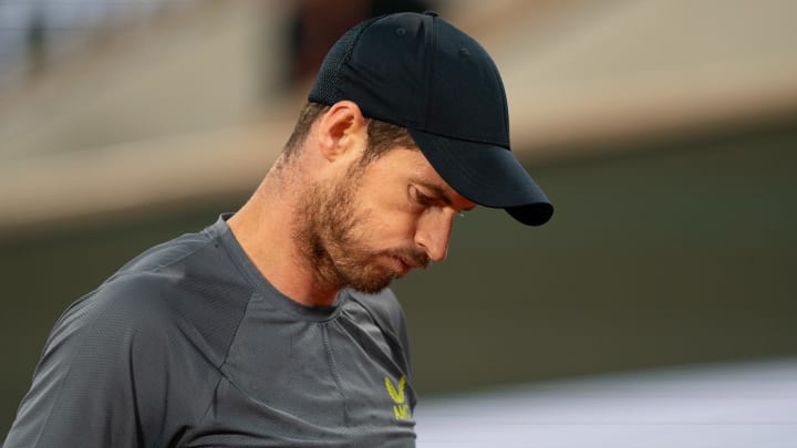 Andy Murray waves goodbye to fans after an injury.