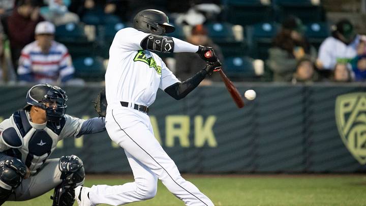 Emeralds outfielder Scott Bandura makes contact with the ball as the Eugene Emeralds host the Try-City Dust Devils in the season opener Friday, April 5, 2024 at PK Park in Eugene, Ore.