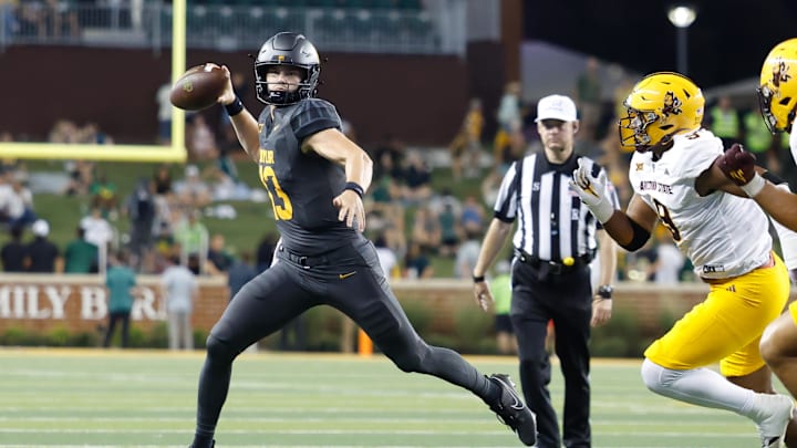 Sep 20, 2025; Waco, Texas, USA; Baylor Bears quarterback Sawyer Robertson (13) looks to pass as Arizona State Sun Devils defensive lineman Elijah O'Neal (9) defends during the first half at McLane Stadium. Mandatory Credit: Chris Jones-Imagn Images
