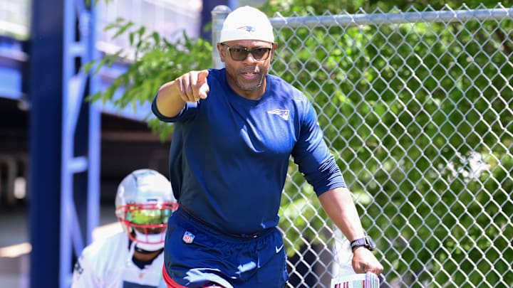 Jun 10, 2024; Foxborough, MA, USA; New England Patriots skills development and kick/punt returners coach Troy Brown walks to the practice fields for minicamp at Gillette Stadium. Mandatory Credit: Eric Canha-Imagn Images