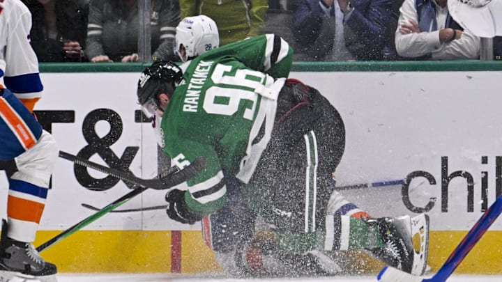 Nov 18, 2025; Dallas, Texas, USA; Dallas Stars right wing Mikko Rantanen (96) is called for a game misconduct penalty for boarding on New York Islanders defenseman Alexander Romanov (28) during the third period at the American Airlines Center. Mandatory Credit: Jerome Miron-Imagn Images