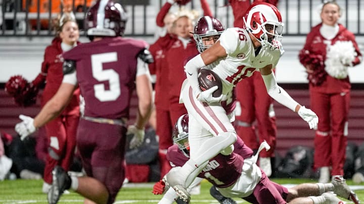 Owasso’s Julius Wilson (16) receives the ball and scores a touchdown during a high school football game between Edmond Memorial and Owasso in Edmond, Okla. on Thursday, Oct. 17, 2024. Owasso’s Julius Wilson (16) receives the ball and scores a touchdown during a high school football game between Edmond Memorial and Owasso in Edmond, Okla. on Thursday, Oct. 17, 2024.