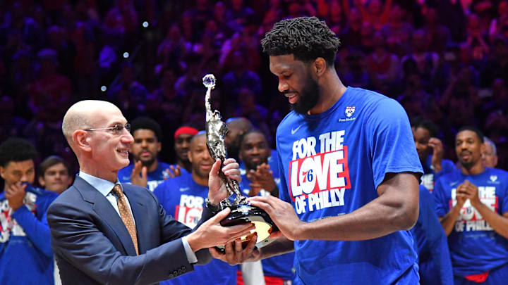 May 5, 2023; Philadelphia, Pennsylvania, USA; Philadelphia 76ers center Joel Embiid (21) accepts the MVP trophy from NBA Commissioner Adam Silver before game three of the 2023 NBA playoff against the Boston Celtics at Wells Fargo Center. Mandatory Credit: Eric Hartline-Imagn Images
