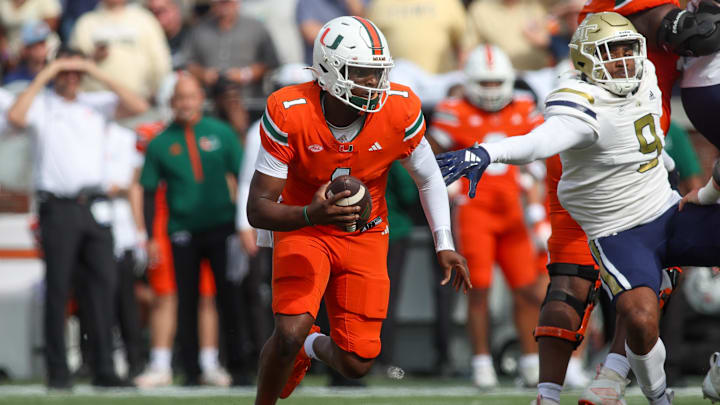 Nov 9, 2024; Atlanta, Georgia, USA; Miami Hurricanes quarterback Cam Ward (1) scrambles against the Georgia Tech Yellow Jackets in the second quarter at Bobby Dodd Stadium at Hyundai Field. Mandatory Credit: Brett Davis-Imagn Images