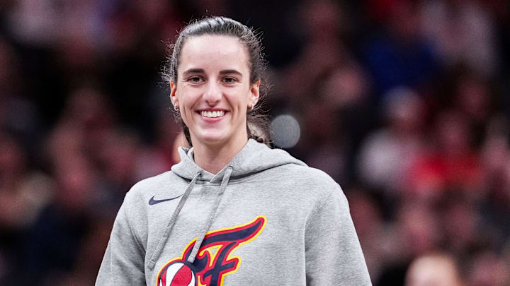 Indiana Fever Caitlin Clark (22) smiles Saturday, May 3, 2025, during a timeout at a preseason game between the Indiana Fever and the Washington Mystics at Gainbridge Fieldhouse in Indianapolis.