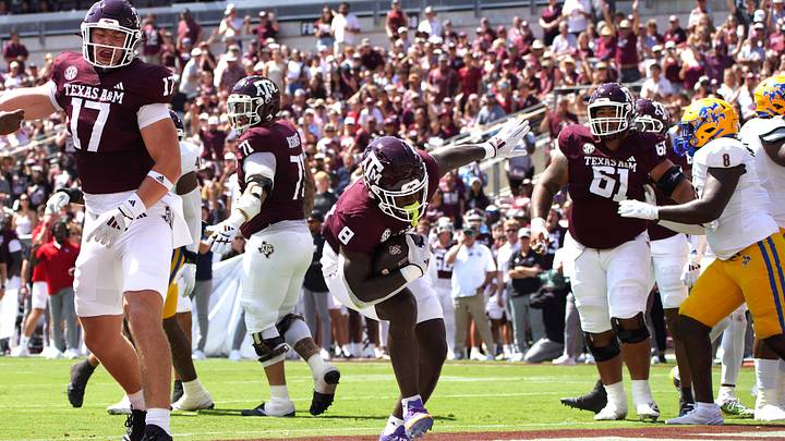 Sep 7, 2024; College Station, Texas, USA; Texas A&M Aggies running back Le'Veon Moss (8) scores a touchdown against the McNeese State Cowboys during the first quarter at Kyle Field.