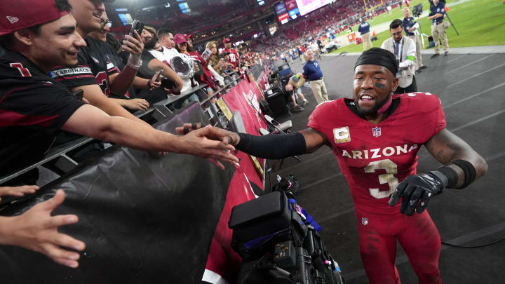 Arizona Cardinals safety Budda Baker (3) high-fives fans as he celebrates their 25-23 win over the Atlanta Falcons at State Farm Stadium on Nov. 12, 2023, in Glendale. Arizona Cardinals safety Budda Baker (3) high-fives fans as he celebrates their 25-23 win over the Atlanta Falcons at State Farm Stadium on Nov. 12, 2023, in Glendale.