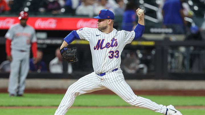 May 26, 2026; New York City, New York, USA;  New York Mets relief pitcher AJ Minter (33) pitches in the ninth inning against the Cincinnati Reds at Citi Field. Mandatory Credit: Wendell Cruz-Imagn Images