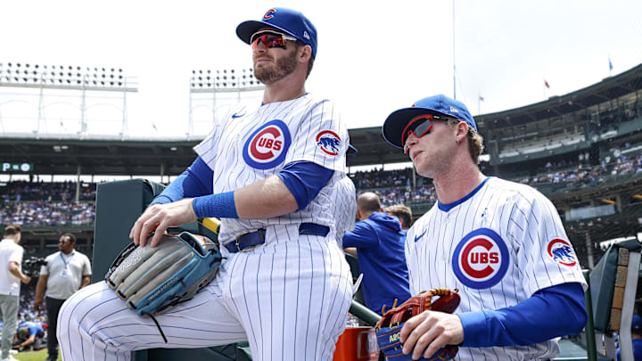 Chicago Cubs left fielder Ian Happ (left) and center fielder Pete Crow-Armstrong (right) in the dugout before a game against the Pittsburgh Pirates at Wrigley Field. Chicago Cubs left fielder Ian Happ (left) and center fielder Pete Crow-Armstrong (right) in the dugout before a game against the Pittsburgh Pirates at Wrigley Field.