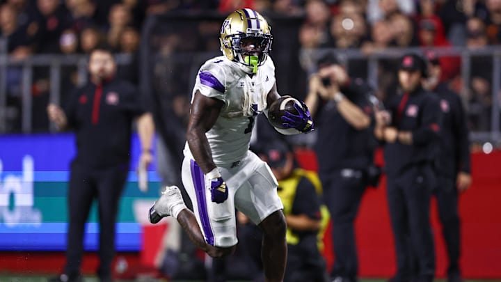 Sep 27, 2024; Piscataway, New Jersey, USA; Washington Huskies running back Jonah Coleman (1) carries the ball during the second half against the Rutgers Scarlet Knights at SHI Stadium. Mandatory Credit: Vincent Carchietta-Imagn Images