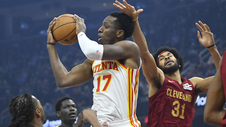 Jan 30, 2025; Cleveland, Ohio, USA; Atlanta Hawks forward Onyeka Okongwu (17) rebounds between Cleveland Cavaliers guard Darius Garland (10) and center Jarrett Allen (31) in the first quarter at Rocket Mortgage FieldHouse. Mandatory Credit: David Richard-Imagn Images Jan 30, 2025; Cleveland, Ohio, USA; Atlanta Hawks forward Onyeka Okongwu (17) rebounds between Cleveland Cavaliers guard Darius Garland (10) and center Jarrett Allen (31) in the first quarter at Rocket Mortgage FieldHouse. Mandatory Credit: David Richard-Imagn Images