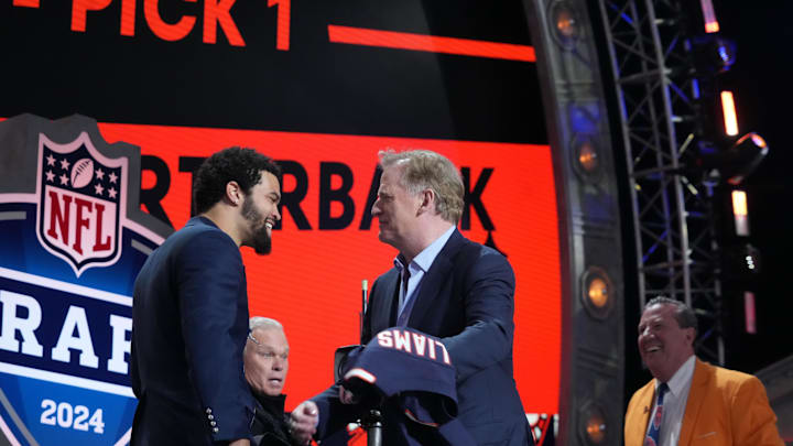 Caleb Williams is greeted by commissioner Roger Goodell after being drafted last spring. 