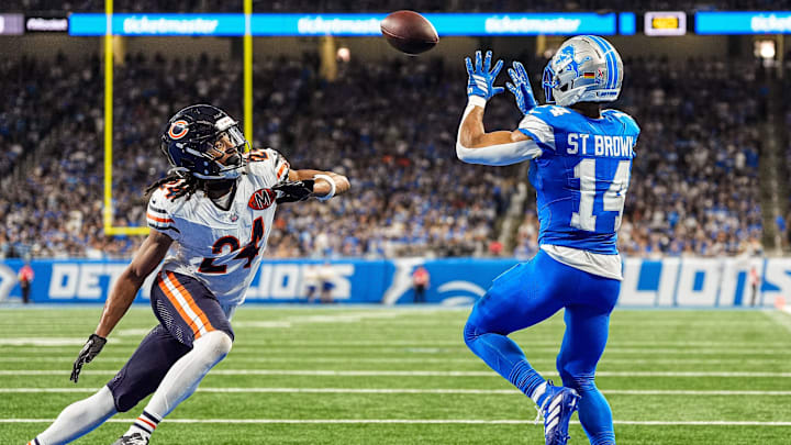 Detroit Lions wide receiver Amon-Ra St. Brown (14) makes a catch for a touchdown against Chicago Bears cornerback Nick McCloud (24) during the second half at Ford Field in Detroit on Sunday, Sept. 14, 2025.