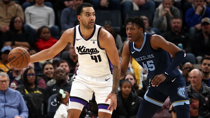 Jan 29, 2024; Memphis, Tennessee, USA; Sacramento Kings forward Trey Lyles (41) handles the ball as Memphis Grizzlies forward GG Jackson (45) defends during the second half at FedExForum. Mandatory Credit: Petre Thomas-USA TODAY Sports