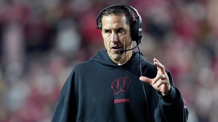 Wisconsin Badgers head coach Luke Fickell talks to his team during the second half against the Illinois Fighting Illini at Camp Randall Stadium. Wisconsin Badgers head coach Luke Fickell talks to his team during the second half against the Illinois Fighting Illini at Camp Randall Stadium.
