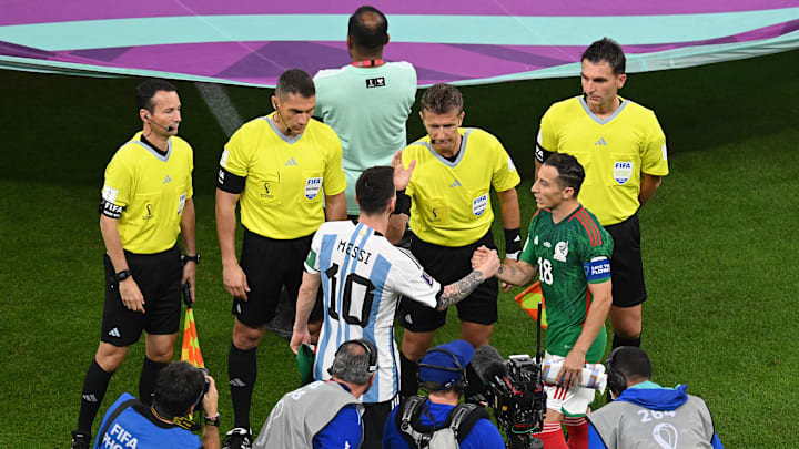 Andres Guardado defends Lionel Messi. Andres Guardado defends Lionel Messi.