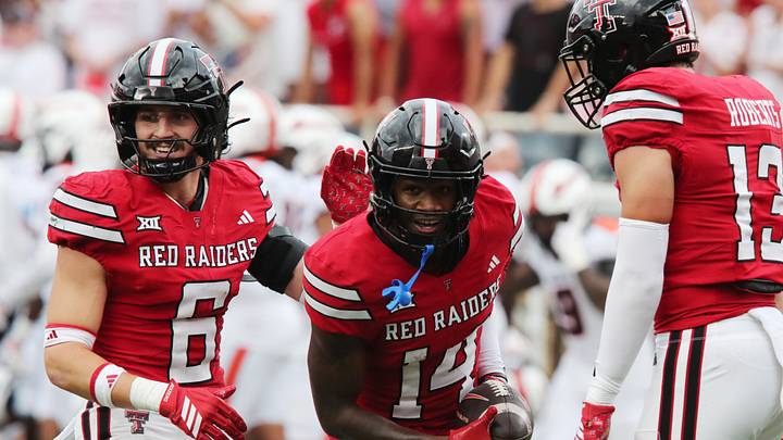 Sep 13, 2025; Lubbock, Texas, USA;  Texas Tech Red Raiders defensive Brice Pollack (14) and defensive back John Curry (6) react after a play against the Oregon State Beavers in the first half at Jones AT&T Stadium. Mandatory Credit: Michael C. Johnson-Imagn Images