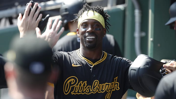 Sep 8, 2024; Pittsburgh, Pennsylvania, USA;  Pittsburgh Pirates designated hitter Andrew McCutchen (22) celebrates in the dugout after hitting a solo home run against the Washington Nationals during the third inning at PNC Park. Mandatory Credit: Charles LeClaire-Imagn Images