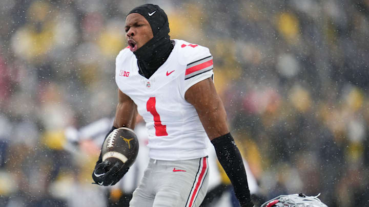 Ohio State Buckeyes cornerback Davison Igbinosun (1) celebrates an interception during the NCAA football game against the Michigan Wolverines at Michigan Stadium.