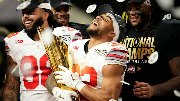 Ohio State Buckeyes running back TreVeyon Henderson (32) celebrates with the trophy following the 34-23 win over the Notre Dame Fighting Irish to win the College Football Playoff National Championship at Mercedes-Benz Stadium in Atlanta on Jan. 22, 2025.