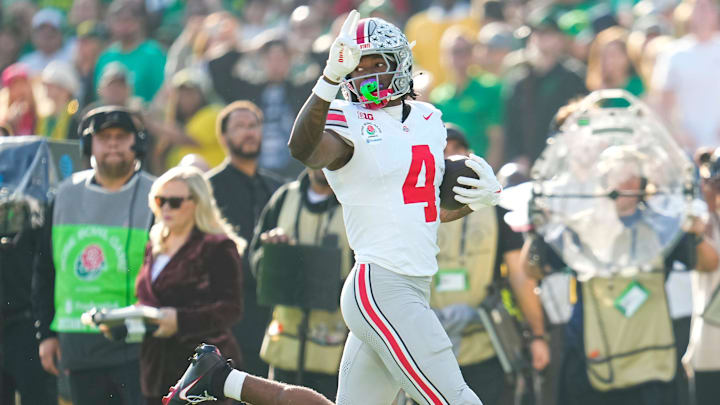 Ohio State Buckeyes wide receiver Jeremiah Smith (4) scores a touchdown during the first half of the College Football Playoff quarterfinal against the Oregon Ducks at the Rose Bowl in Pasadena, Calif. on Jan. 1, 2025.