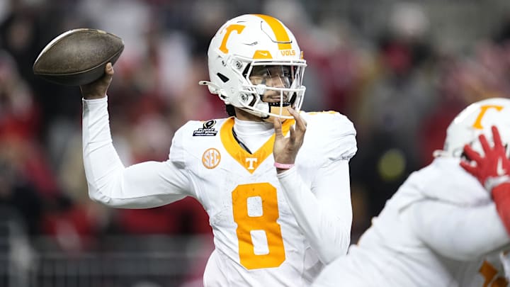 Dec 21, 2024; Columbus, Ohio, USA; Tennessee Volunteers quarterback Nico Iamaleava (8) throws against the Ohio State Buckeyes during the second half of the College Football Playoff first round game at Ohio Stadium. Ohio State won 42-17. Mandatory Credit: Adam Cairns-Imagn Images