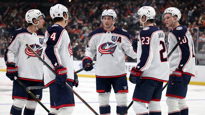 Dec 20, 2025; Anaheim, California, USA;  Columbus Blue Jackets defenseman Zach Werenski (middle) huddles with center Cole Sillinger (4) and center Sean Monahan (23) and left wing Dmitri Voronkov (10) during the third period against the Anaheim Ducks at Honda Center. Mandatory Credit: Kiyoshi Mio-Imagn Images