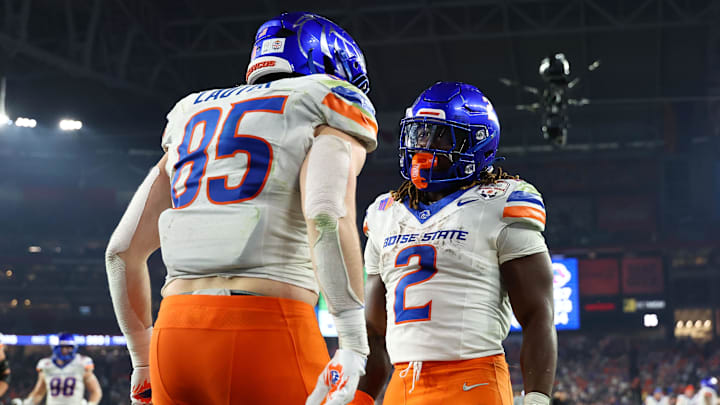 Dec 31, 2024; Glendale, AZ, USA; Boise State Broncos tight end Matt Lauter (85) reacts with running back Ashton Jeanty (2) after scoring a touchdown during the second half in the Fiesta Bowl at State Farm Stadium. Mandatory Credit: Mark J. Rebilas-Imagn Images