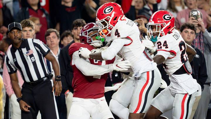 Oct 10, 2026; Tuscaloosa, Alabama, USA;  Georgia defensive back KJ Bolden (4) hits Alabama wide receiver Rico Scott (7) well before the ball arrives at Saban Field at Bryant-Denny Stadium. No penalty was called. Mandatory Credit: Gary Cosby Jr.-Imagn Images
