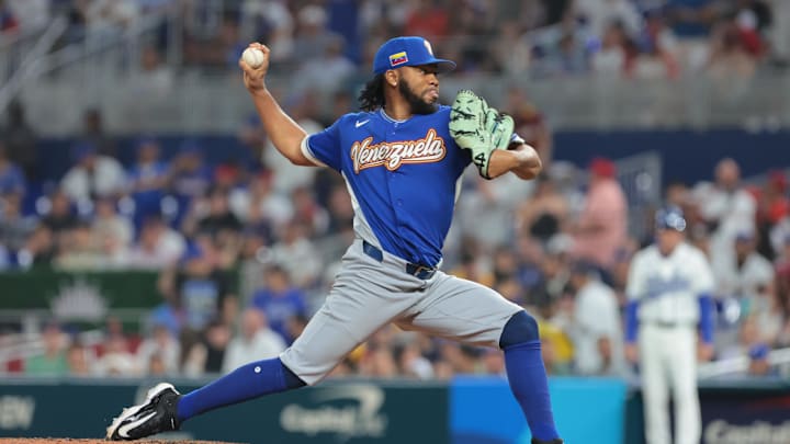Mar 16, 2026; Miami, FL, United States; Venezuela pitcher Eduard Bazardo (83) throws the the plate in the seventh inning against Italy during a semifinal game of the 2026 World Baseball Classic at loanDepot Park. Mandatory Credit: Sam Navarro-Imagn Images