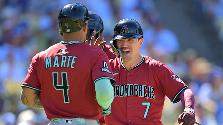 Aug 31, 2025; Los Angeles, California, USA; Arizona Diamondbacks left fielder Corbin Carroll (7) is congratulated by second baseman Ketel Marte (4) after crossing the plate a three-run home run during the eighth inning off Los Angeles Dodgers relief pitcher Tanner Scott (66) at Dodger Stadium. Mandatory Credit: Jayne Kamin-Oncea-Imagn Images Aug 31, 2025; Los Angeles, California, USA; Arizona Diamondbacks left fielder Corbin Carroll (7) is congratulated by second baseman Ketel Marte (4) after crossing the plate a three-run home run during the eighth inning off Los Angeles Dodgers relief pitcher Tanner Scott (66) at Dodger Stadium. Mandatory Credit: Jayne Kamin-Oncea-Imagn Images
