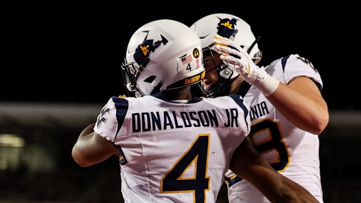 Oct 26, 2024; Tucson, Arizona, USA; West Virginia Mountaineers running back CJ Donaldson Jr. (4) celebrates touchdown made against the Arizona Wildcats during the third quarter at Arizona Stadium. Mandatory Credit: Aryanna Frank-Imagn Images