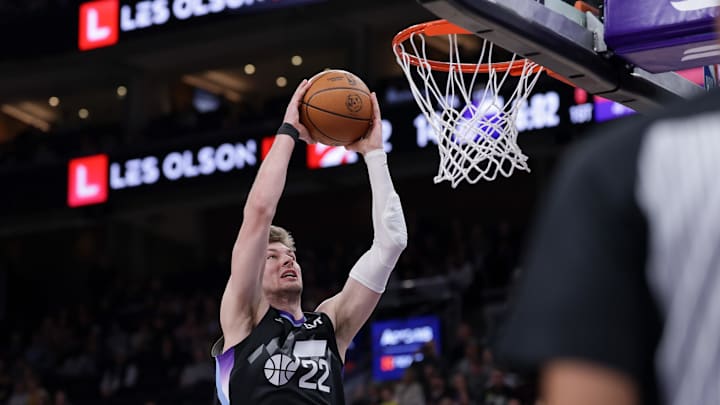 Mar 14, 2025; Salt Lake City, Utah, USA;  Utah Jazz forward Kyle Filipowski (22) attempts to dunk the ball during the first quarter against the Toronto Raptors at Delta Center. Mandatory Credit: Chris Nicoll-Imagn Images