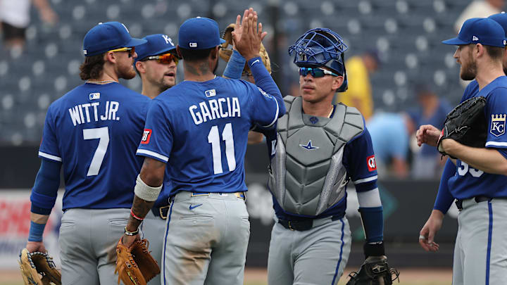 May 1, 2025; St. Petersburg, Florida, USA; Kansas City Royals shortstop Bobby Witt Jr. (7), third base Maikel Garcia (11), catcher Freddy Fermin (34) and teammates celebrate after they beat the Tampa Bay Rays  at George M. Steinbrenner Field. Mandatory Credit: Kim Klement Neitzel-Imagn Images