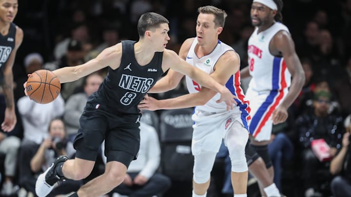 Nov 7, 2025; Brooklyn, New York, USA;  Brooklyn Nets guard Egor Demin (8) looks to drive past Detroit Pistons forward Duncan Robinson (55) in the second quarter at Barclays Center. Mandatory Credit: Wendell Cruz-Imagn Images