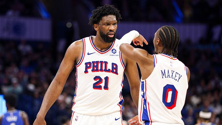 Jan 9, 2026; Orlando, Florida, USA; Philadelphia 76ers center Joel Embiid (21) reacts to guard Tyrese Maxey (0) against the Orlando Magic in the third quarter at Kia Center. Mandatory Credit: Nathan Ray Seebeck-Imagn Images
