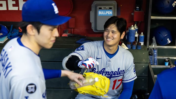 May 9, 2025; Phoenix, Arizona, USA; Los Angeles Dodgers designated hitter Shohei Ohtani (17) greets Roki Sasaki in the dugout against the Arizona Diamondbacks at Chase Field. Mandatory Credit: Mark J. Rebilas-Imagn Images May 9, 2025; Phoenix, Arizona, USA; Los Angeles Dodgers designated hitter Shohei Ohtani (17) greets Roki Sasaki in the dugout against the Arizona Diamondbacks at Chase Field. Mandatory Credit: Mark J. Rebilas-Imagn Images