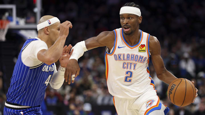 aMar 17, 2026; Orlando, Florida, USA; Oklahoma City Thunder guard Shai Gilgeous-Alexander (2) drives to the basket past Orlando Magic guard Jalen Suggs (4) in the third quarter at Kia Center. Mandatory Credit: Nathan Ray Seebeck-Imagn Images aMar 17, 2026; Orlando, Florida, USA; Oklahoma City Thunder guard Shai Gilgeous-Alexander (2) drives to the basket past Orlando Magic guard Jalen Suggs (4) in the third quarter at Kia Center. Mandatory Credit: Nathan Ray Seebeck-Imagn Images