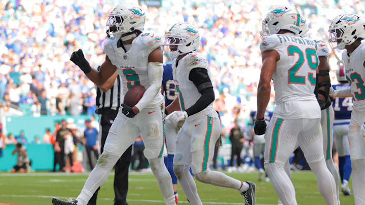 Nov 9, 2025; Miami Gardens, Florida, USA; Miami Dolphins safety Ifeatu Melifonwu (9) celebrates with safety Dante Trader Jr. (11) and safety Minkah Fitzpatrick (29) after an interception against the Buffalo Bills during the second half at Hard Rock Stadium. 