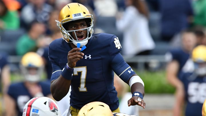 Sep 8, 2018; South Bend, IN, USA; Notre Dame Fighting Irish quarterback Brandon Wimbush (7) yells to his teammates in the second  quarter against the Ball State Cardinals at Notre Dame Stadium. 